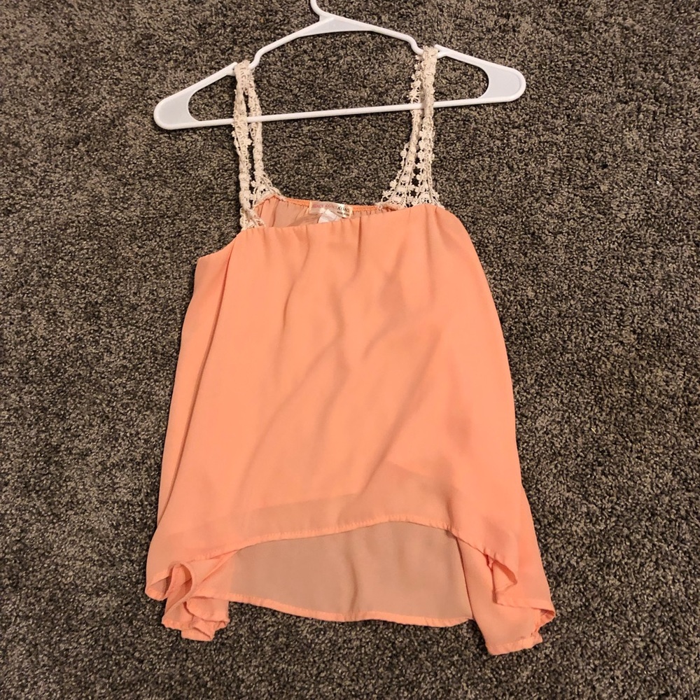 a light peach colored top